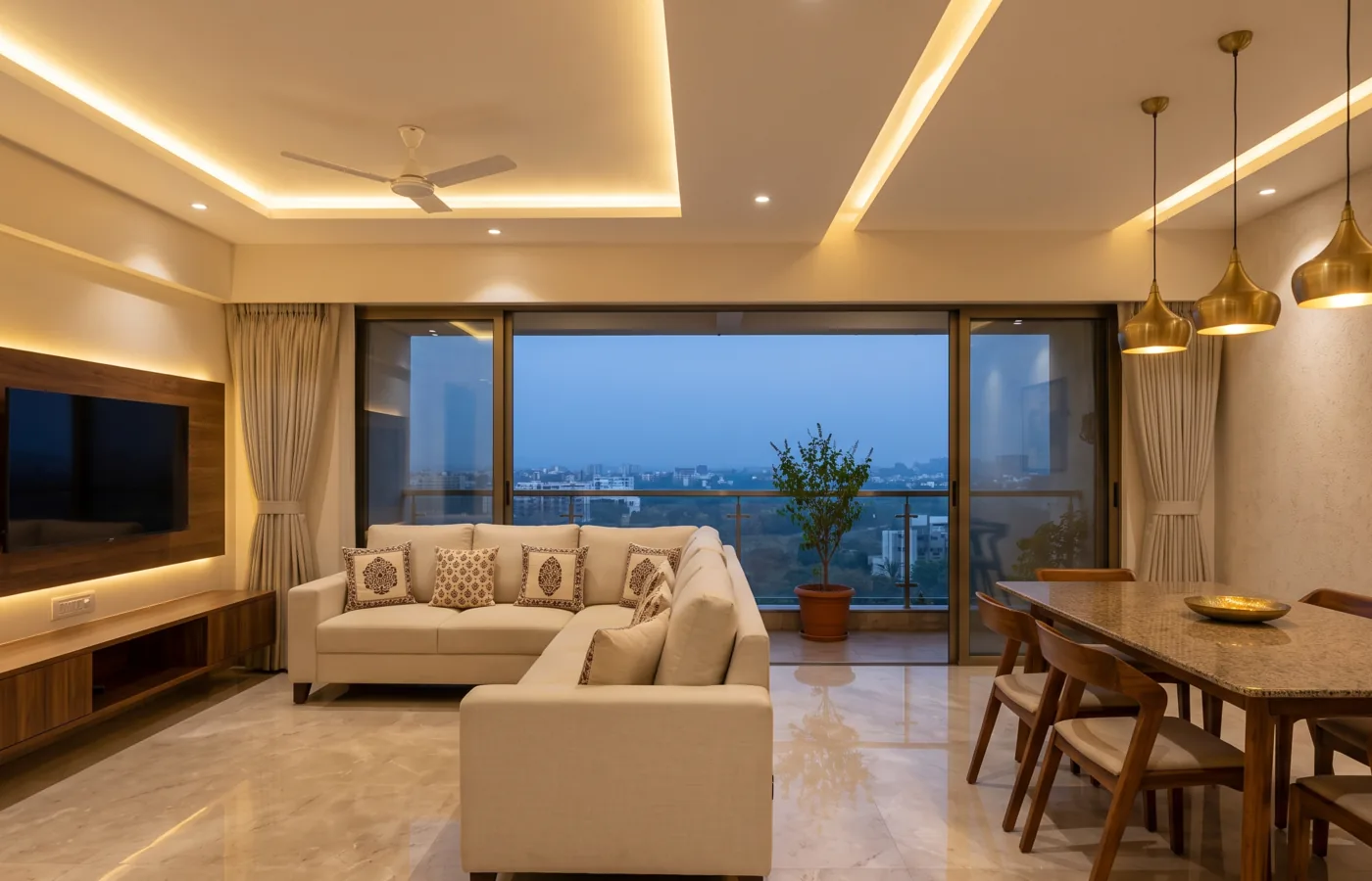 Modern open-plan living-dining with cove lighting